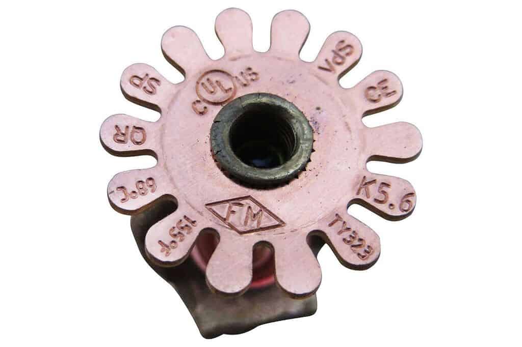 Fire sprinkler deflector with stamp