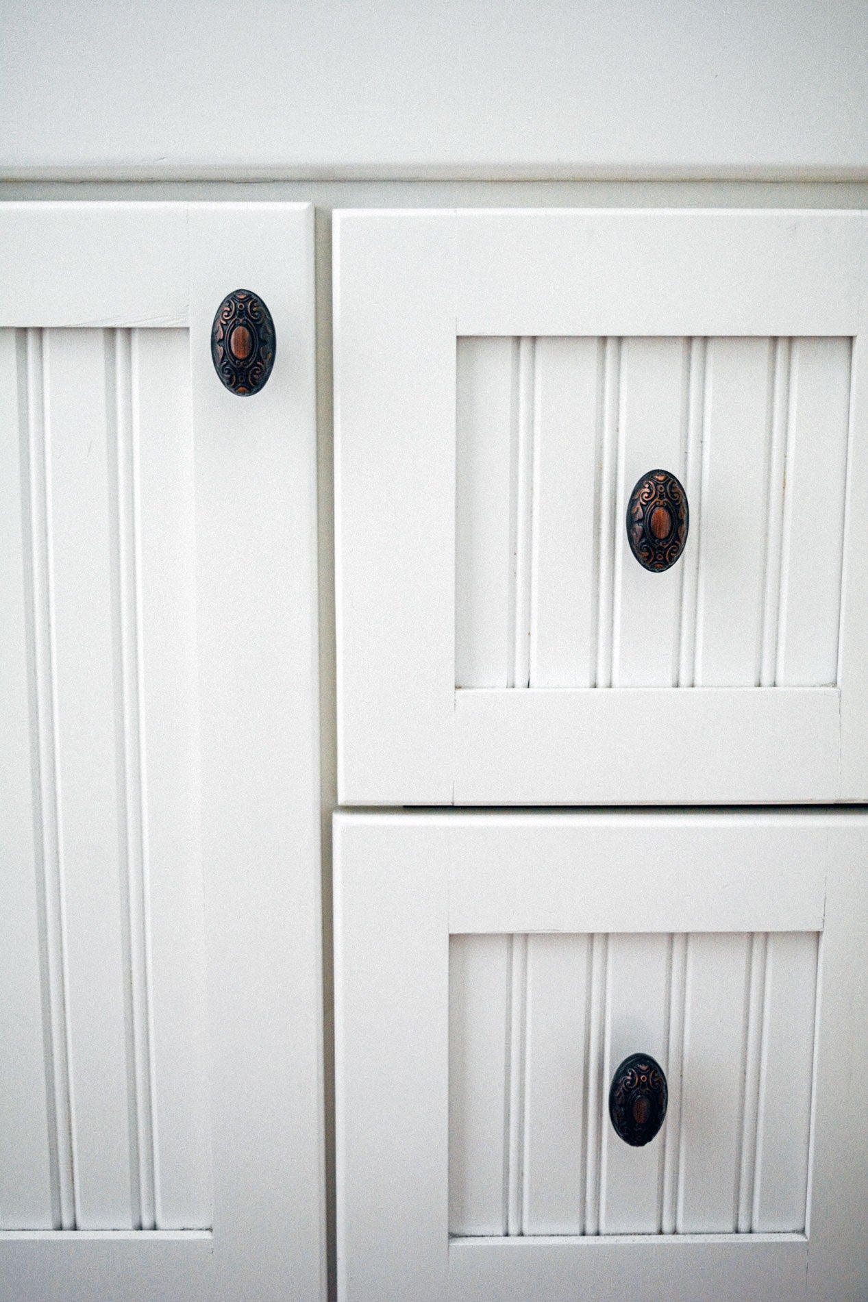 white cabinets with bronze victorian cabinet knobs