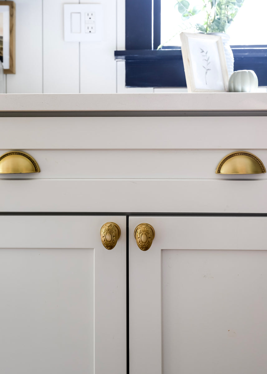 white kitchen cabinets brass cabinet hardware